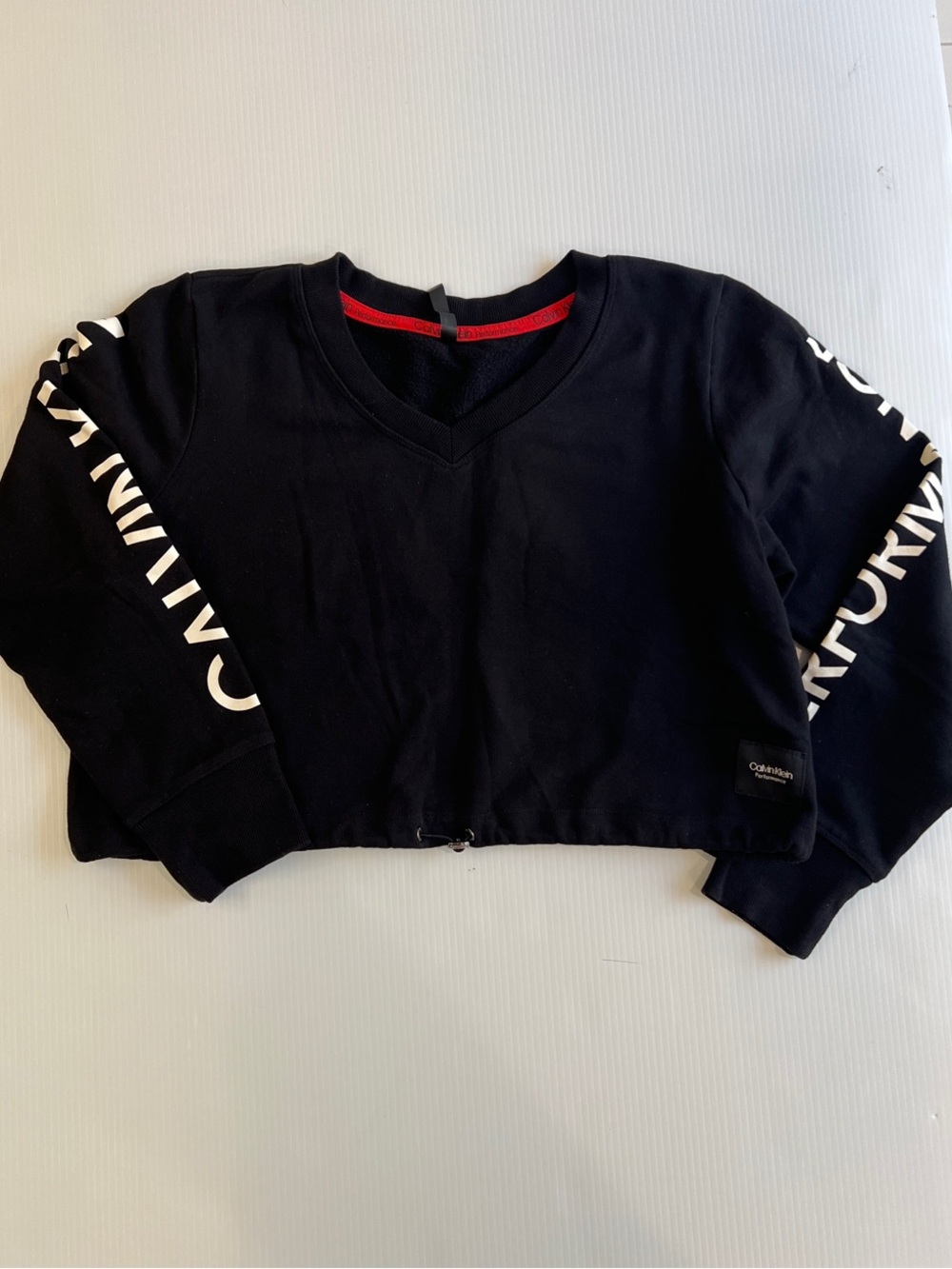 Calvin Klein Women’s Black Cropped V-Neck Sweatshirt with Logo on Sleeve